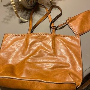 Super soft faux leather bag with attached coin  purse.  No wear like new